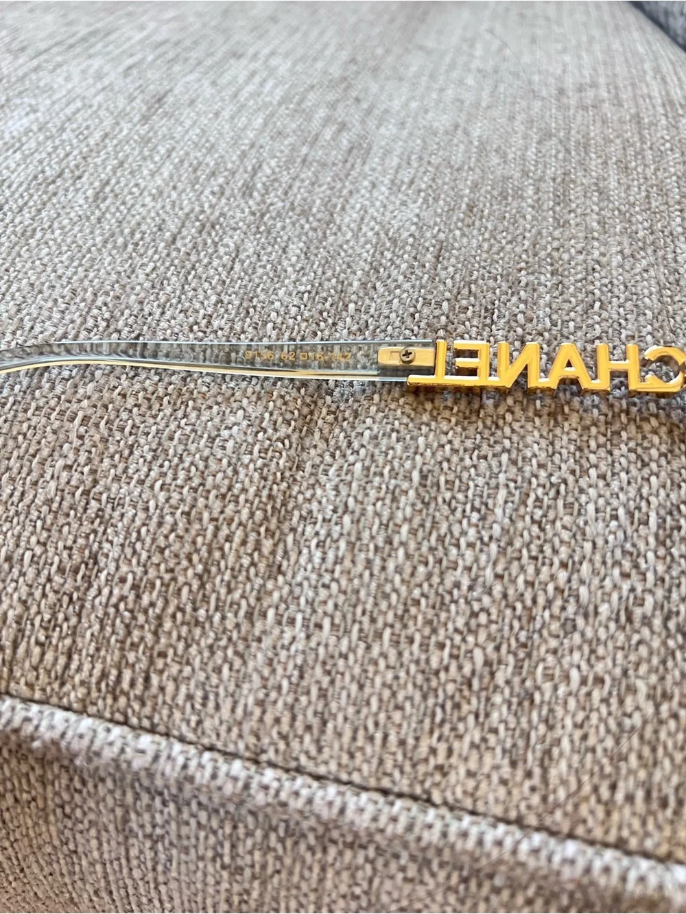 CHANEL Transparent Light Blue Frame Glasses with Gold Logos